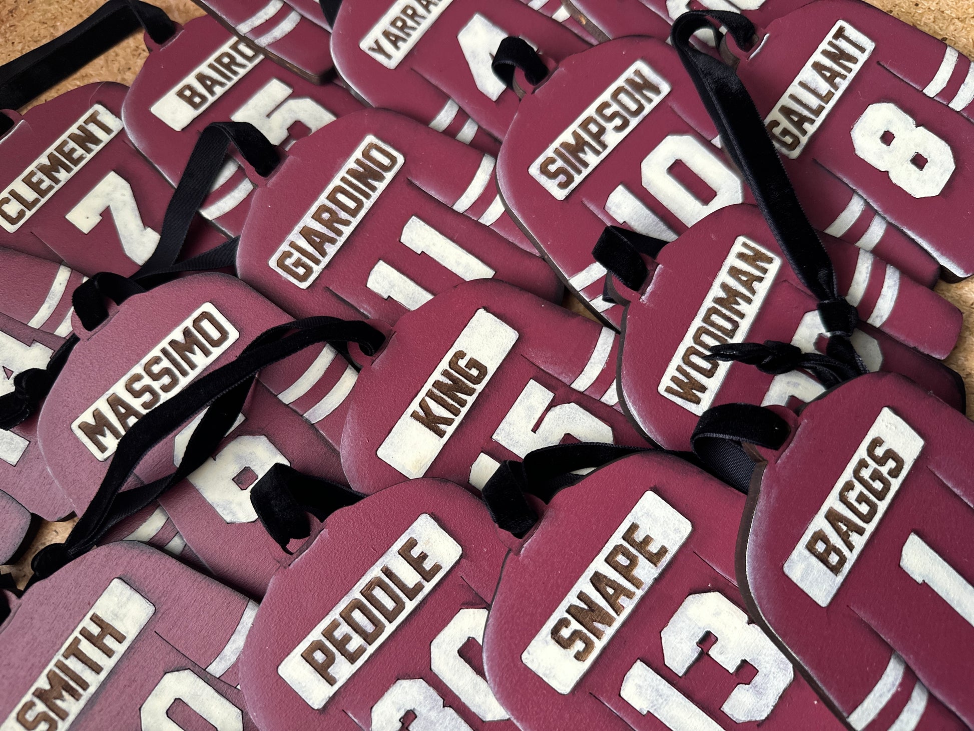 Hand Painted Jerseys featuring clients numbers and last names in the jersey colour of your choice.