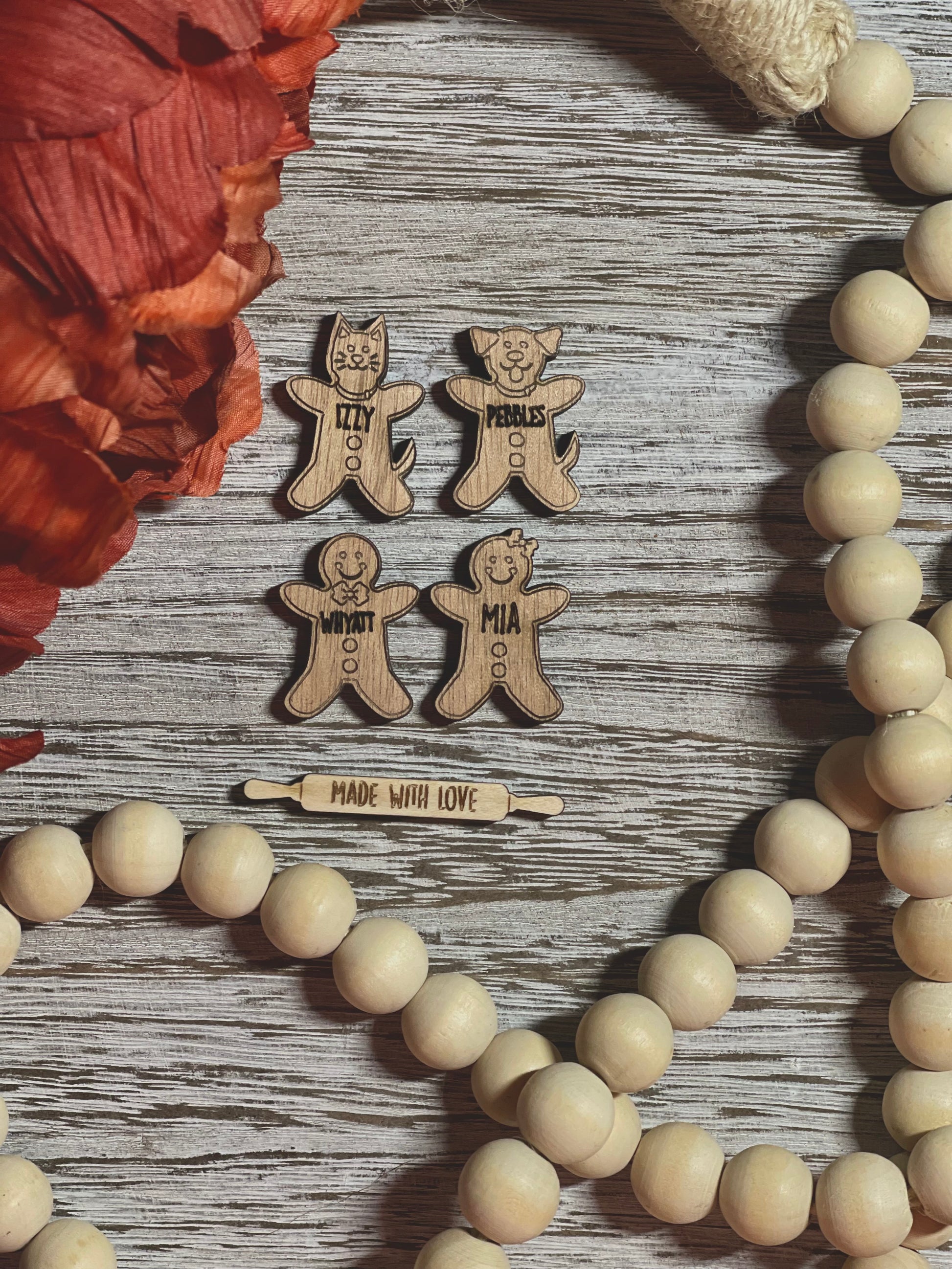 An ornament tray showcasing family members in gingerbread cookie form.