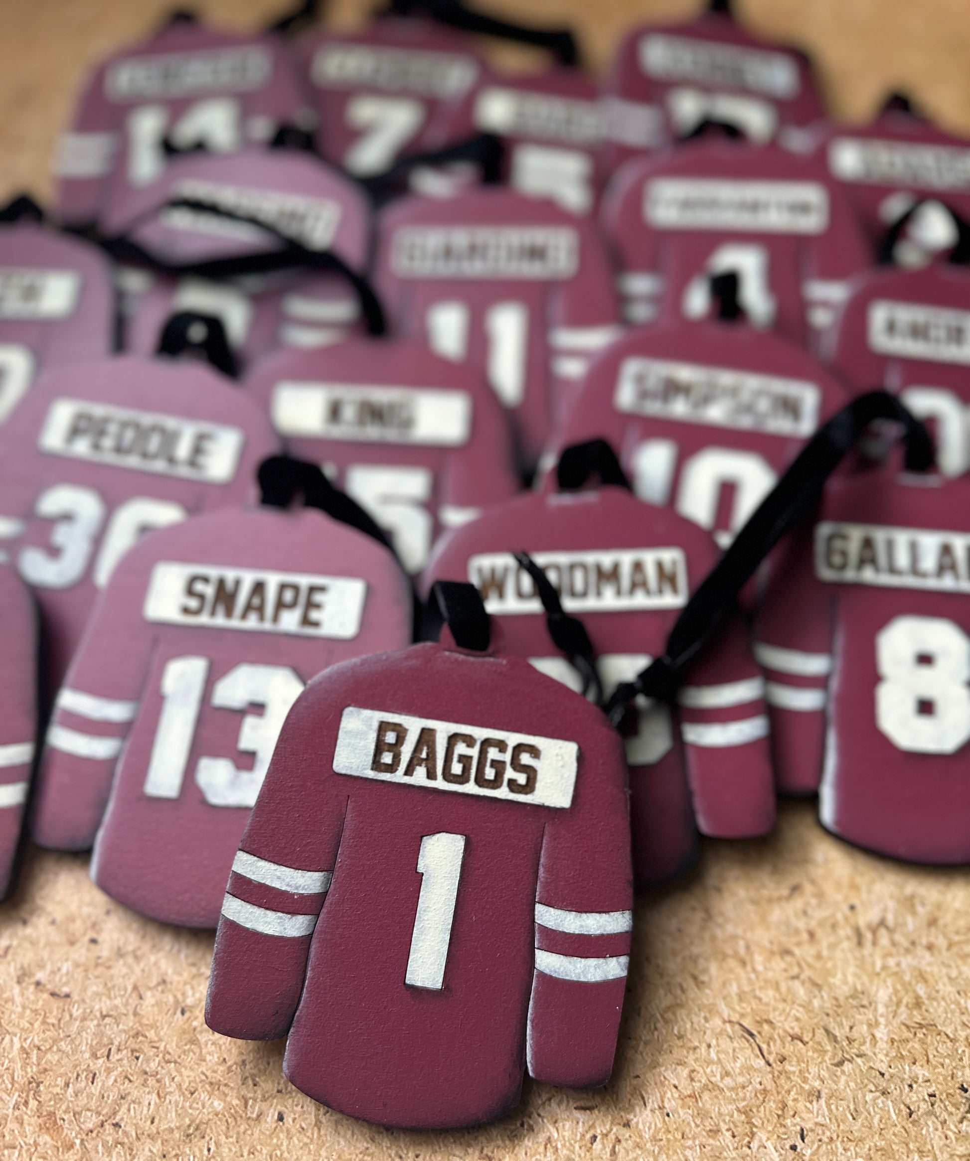 Hand Painted Jerseys featuring clients numbers and last names in the jersey colour of your choice. 